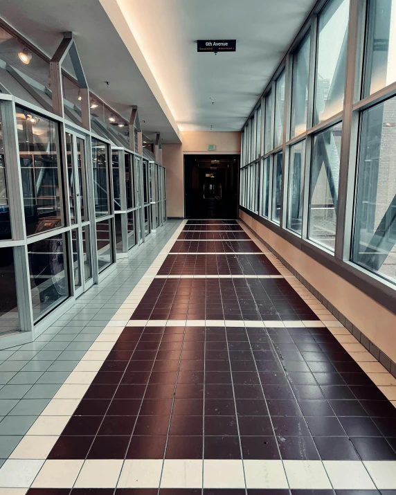 looking down a corridor in a building with windows