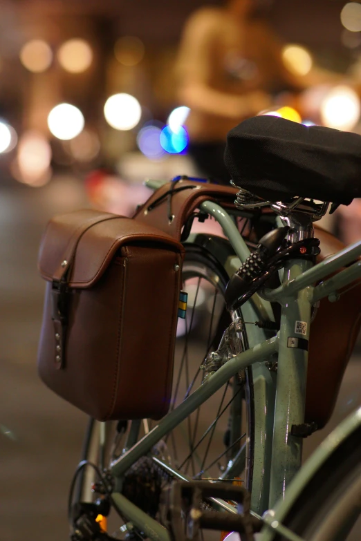 an old - fashioned bicycle has its front basket folded on it's handlebars