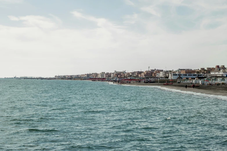 a body of water next to small buildings