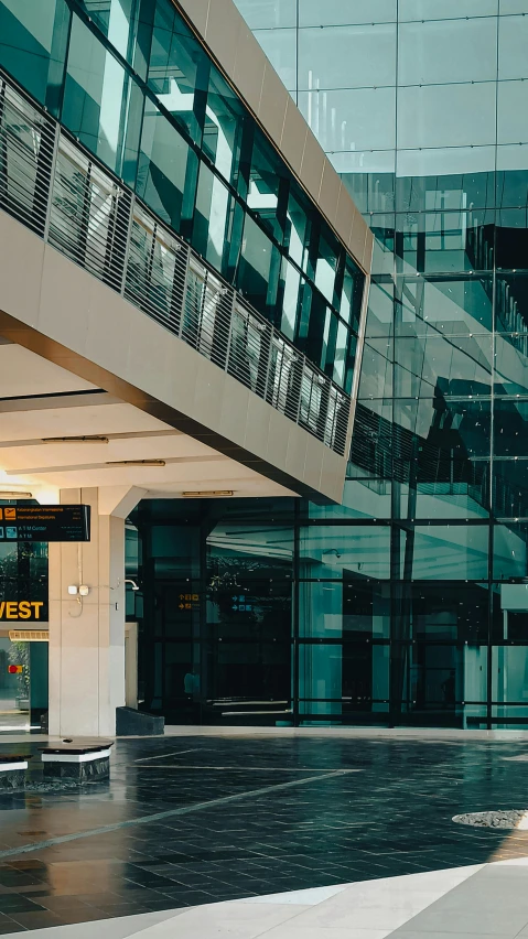 a man standing in the middle of an empty atrium