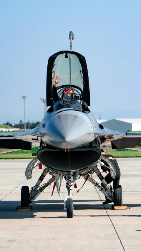 a jet with its engine parked on the tarmac