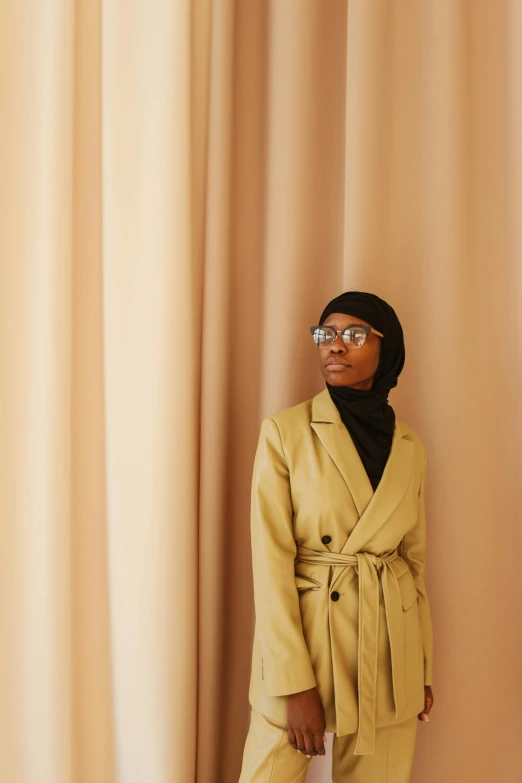 a person standing in front of a curtain