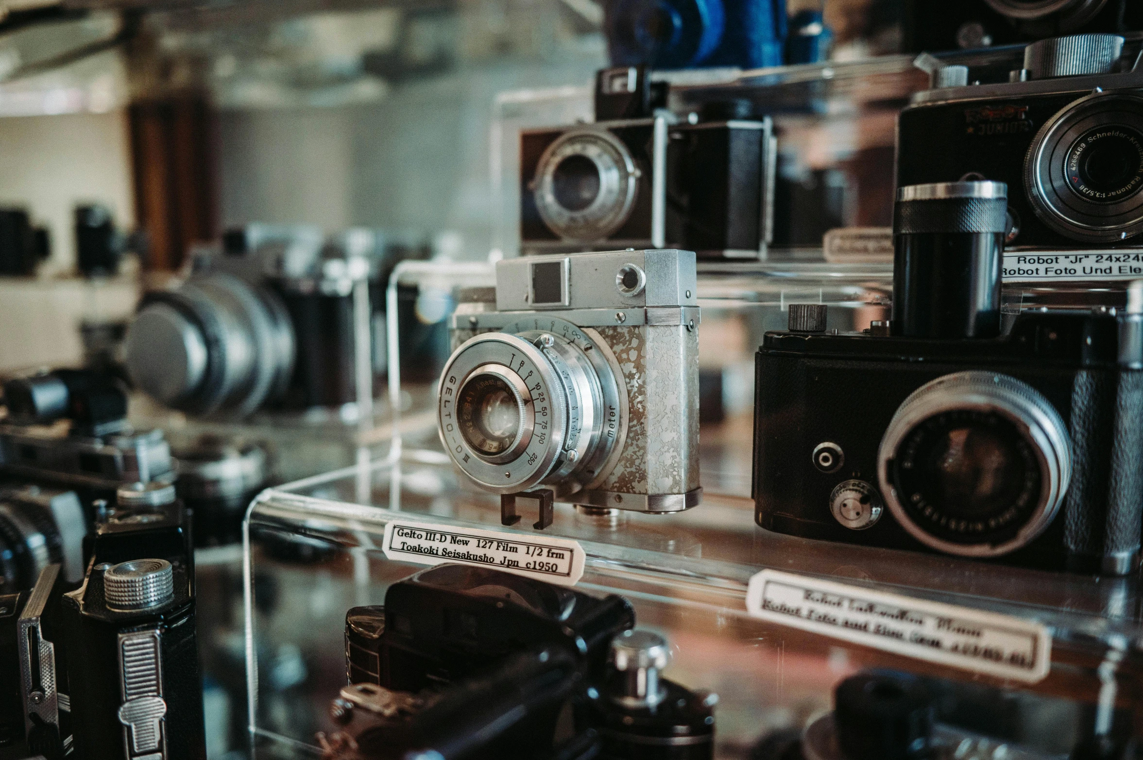 there are several cameras on display together