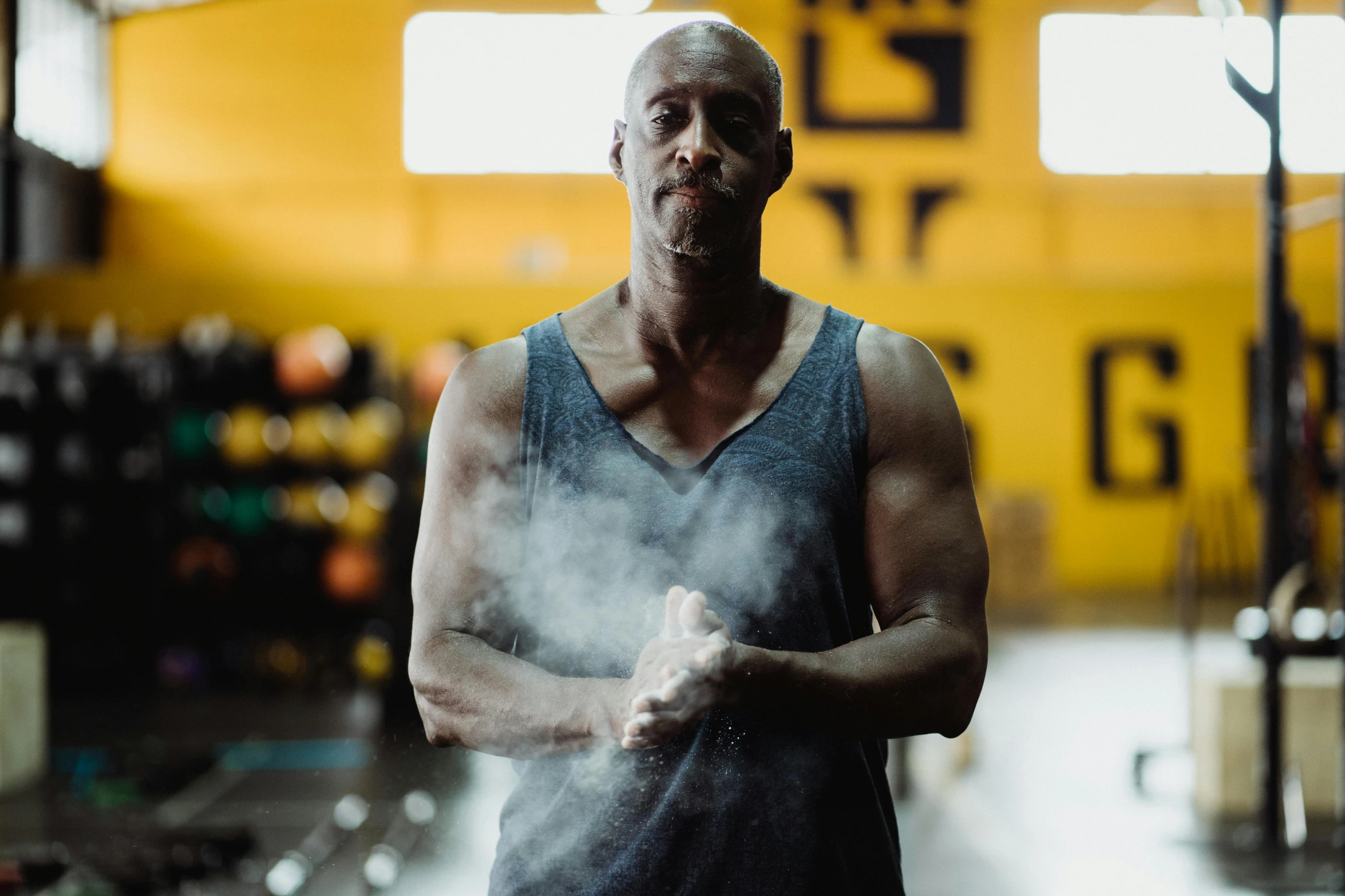 a man standing in a building with steam coming out of his chest