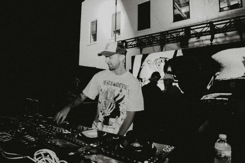 a man using dj equipment to record records at a party