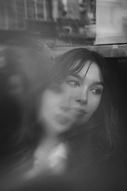 black and white po of two people in an elevator