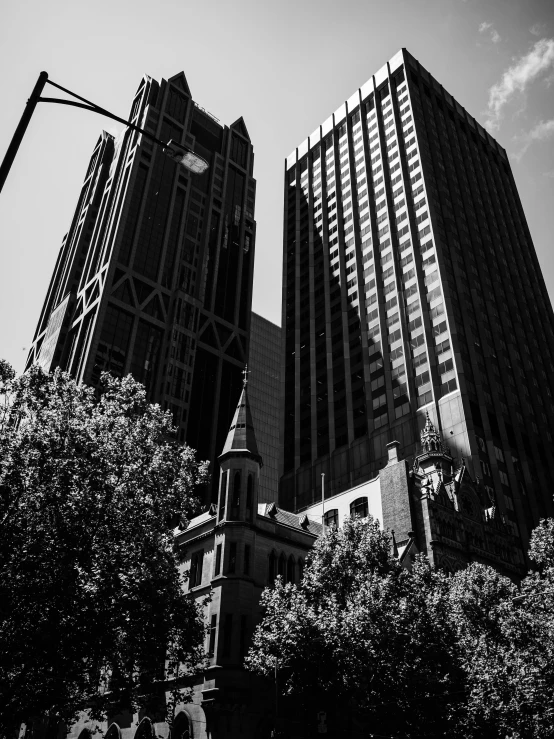 black and white po of tall building with clock tower