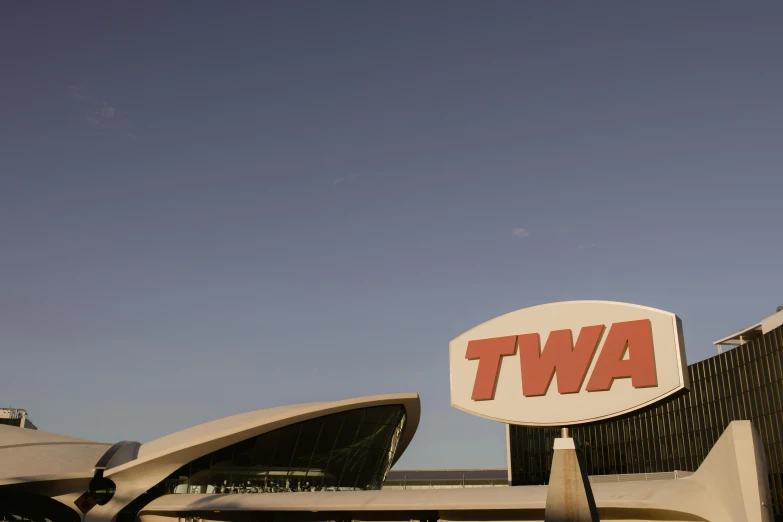 a building with a twa sign in front of it