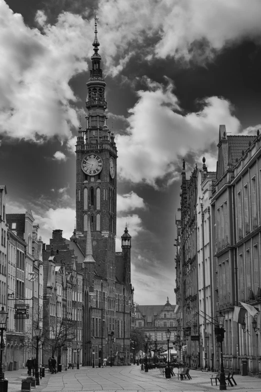 an old city street with buildings and a clock tower