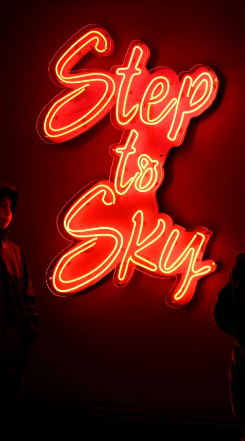 a large neon sign that says step to sky