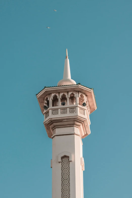 a tower with a sky in the background