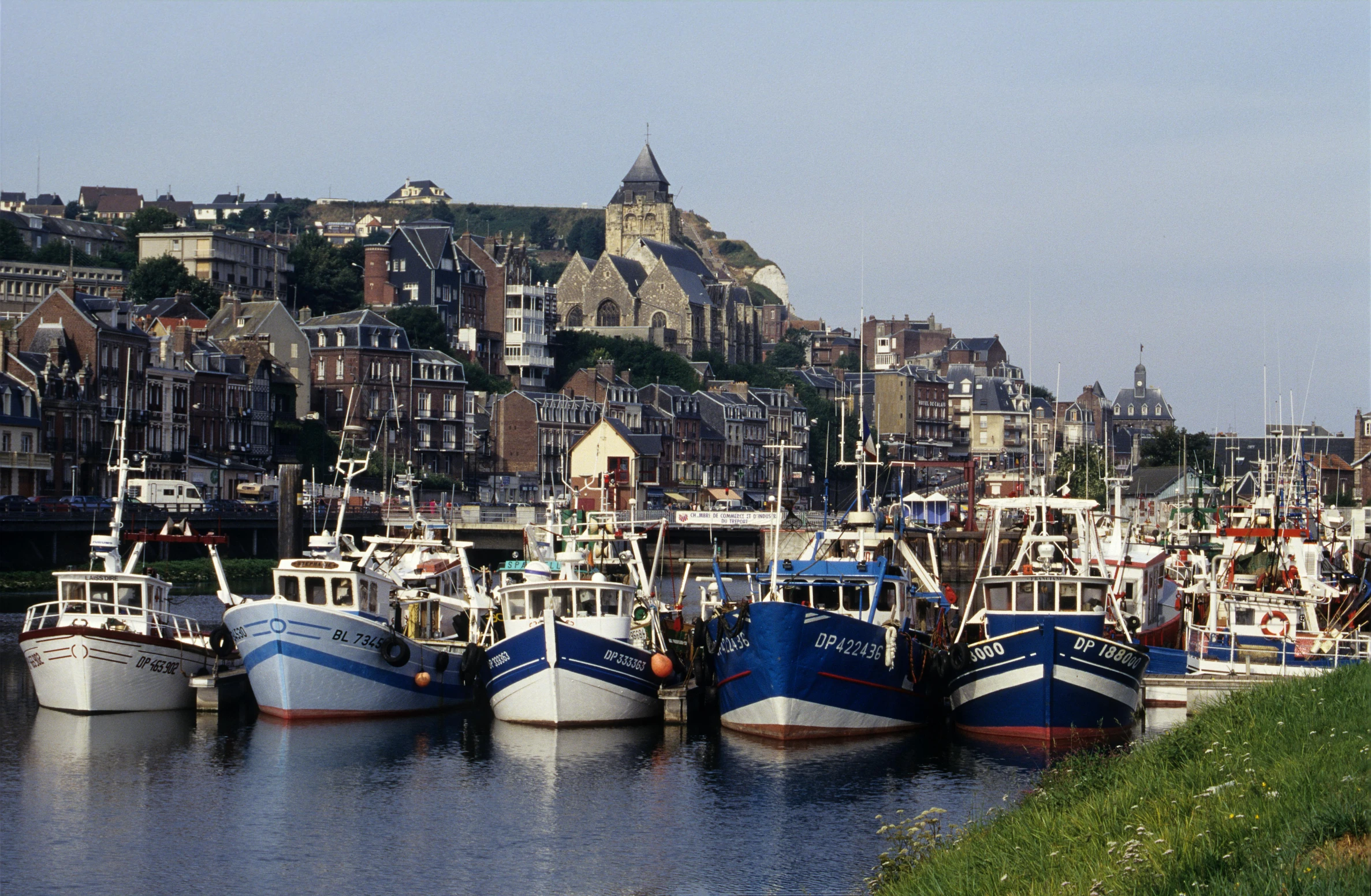 a harbor filled with lots of boats near buildings