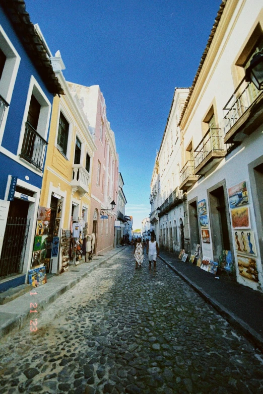 a street filled with people walking across it