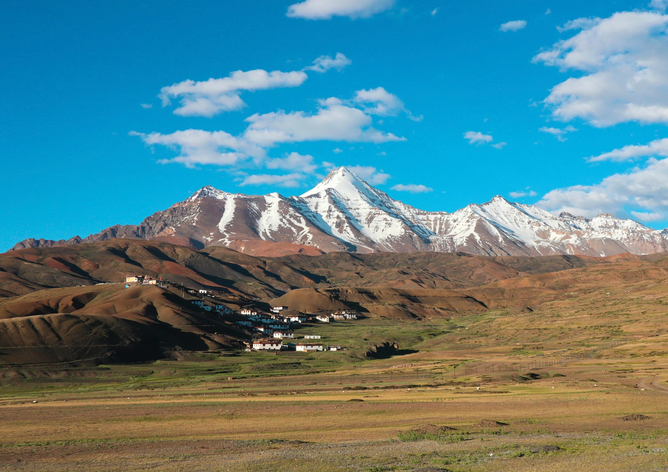 a beautiful landscape with a snow capped mountain