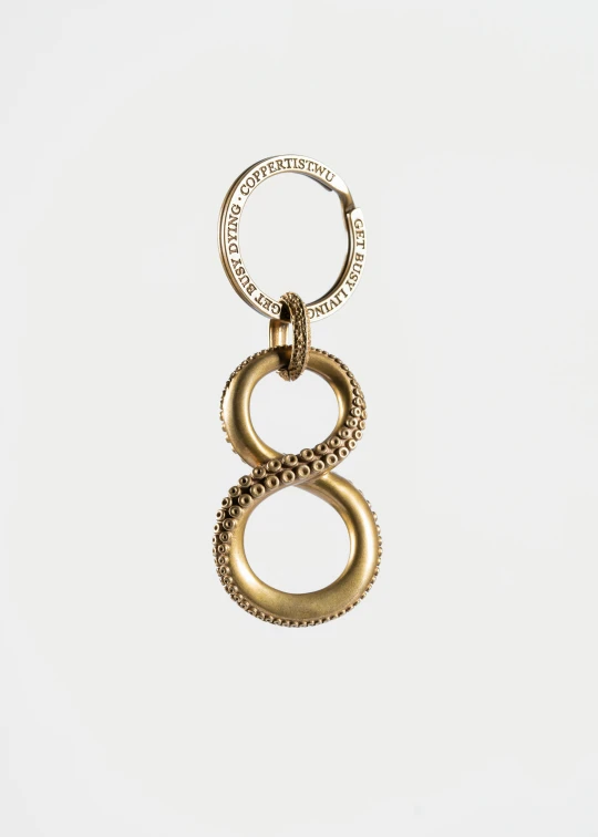 a metal keyring with a loop of chains on the end