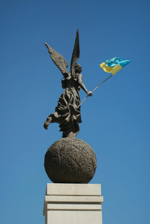 a large statue is on the top of a pedestal