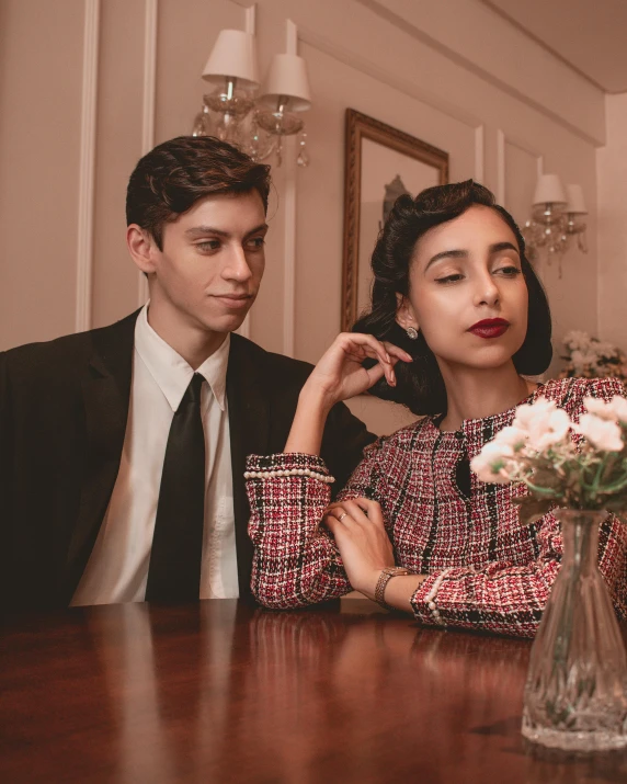 the young couple is sitting down in their apartment for some serious time