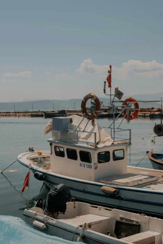 two large boats docked at an airport dock