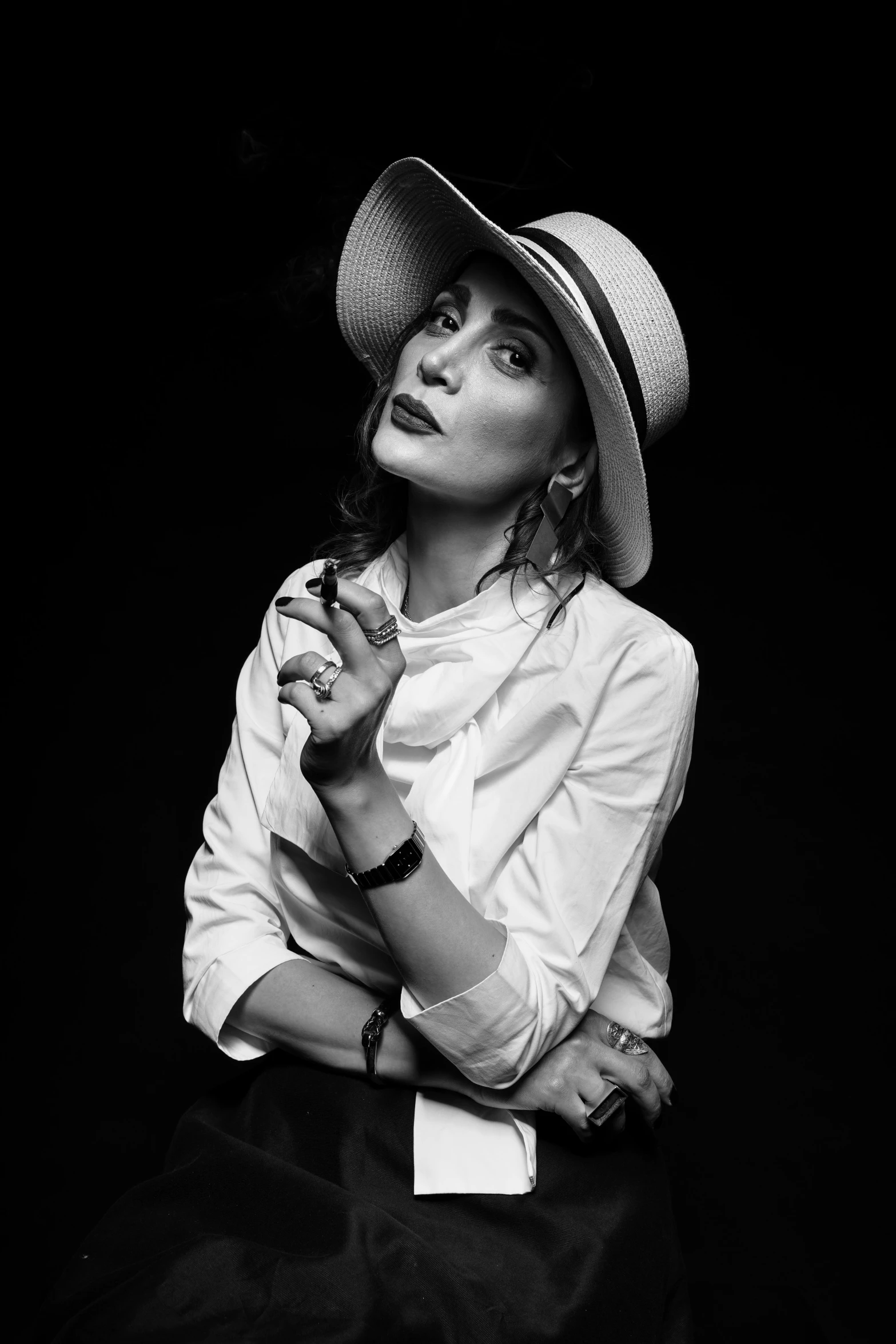 a woman is posing with her hat on