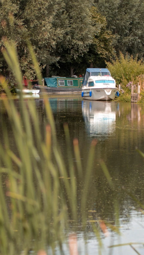 the boat is moving down the water by the land