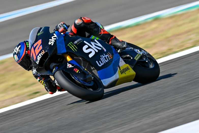 a motorcycle rider riding on the race track