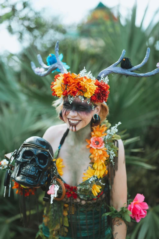 a man with flowers and antlers in his face