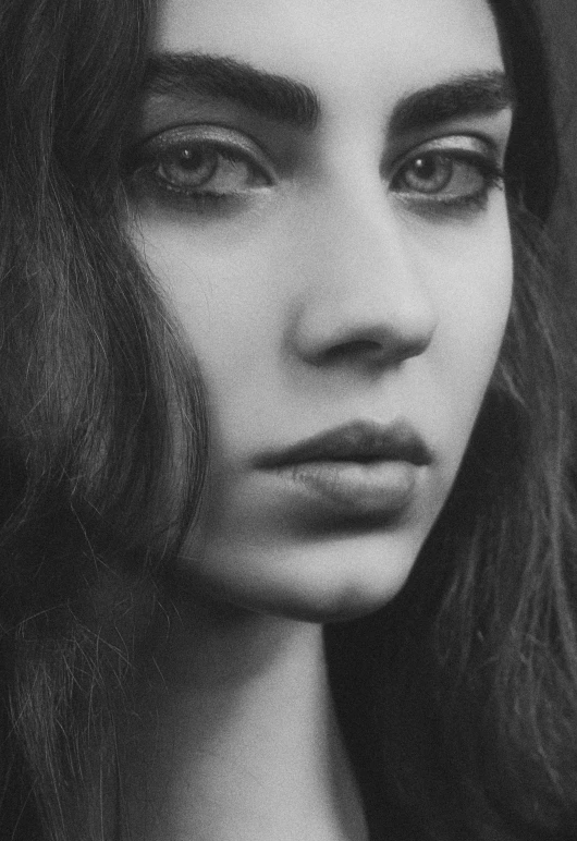 a woman looking at the camera with very long hair