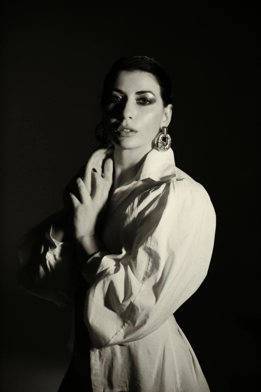 a woman standing in front of a black background