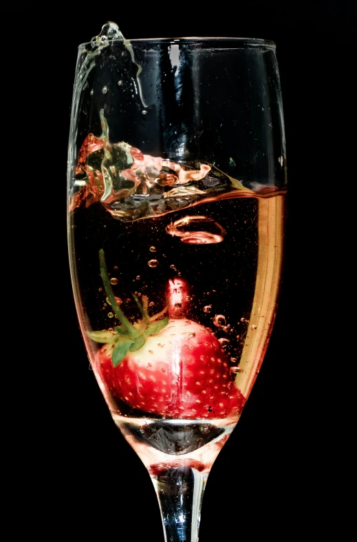 wine pouring in a wine glass filled with liquid