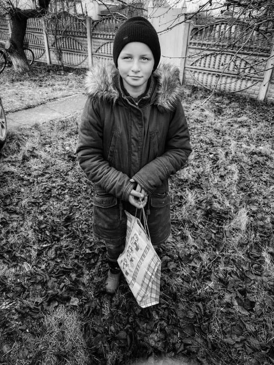 small girl in a parka with a umbrella