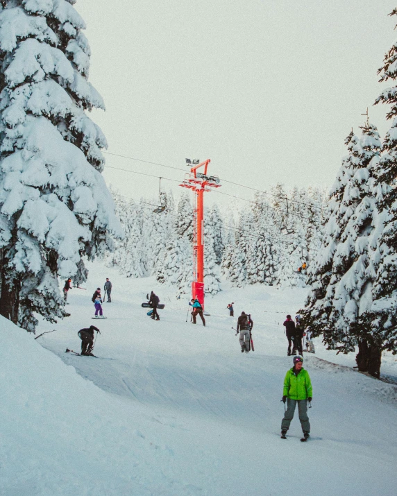 a bunch of people outside riding skis and snowboard