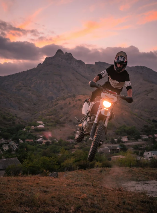 a person in the air on a motorcycle jumping