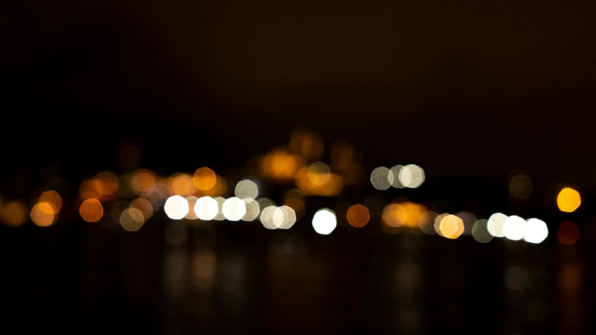 the city lights in the distance are blurry