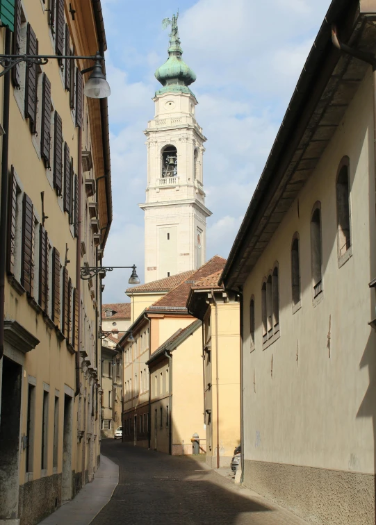 the narrow street that goes through the city with tall buildings