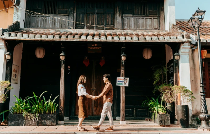 a couple of women walking across a street