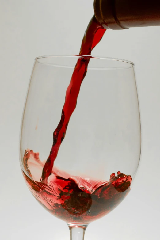 the wine has been poured into the glass