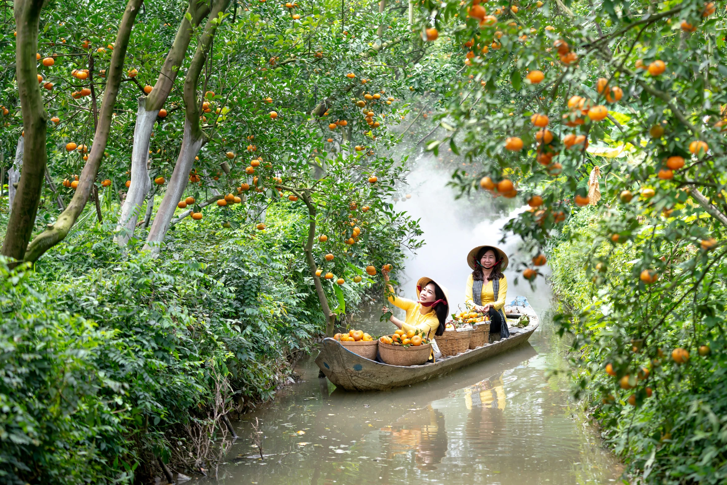 a small boat filled with people and two sitting on a boat