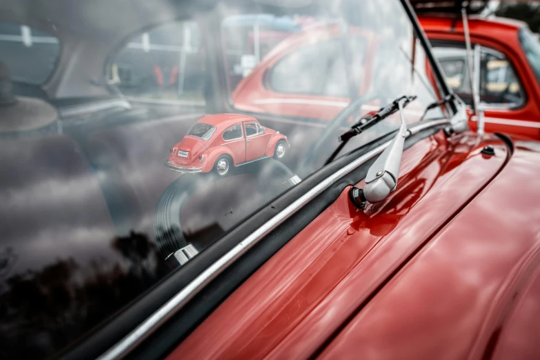 the old red cars are parked in the lot