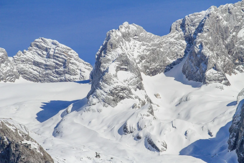 the view of mountain tops covered in snow