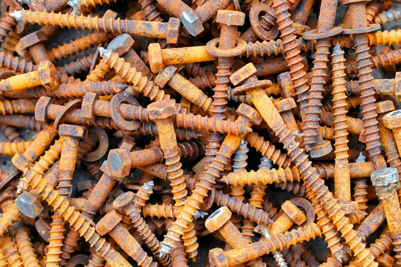 close up image of screws and nutions on a pile