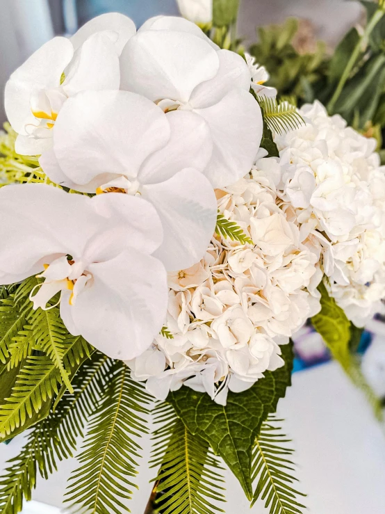 there are flowers in the vase on a table