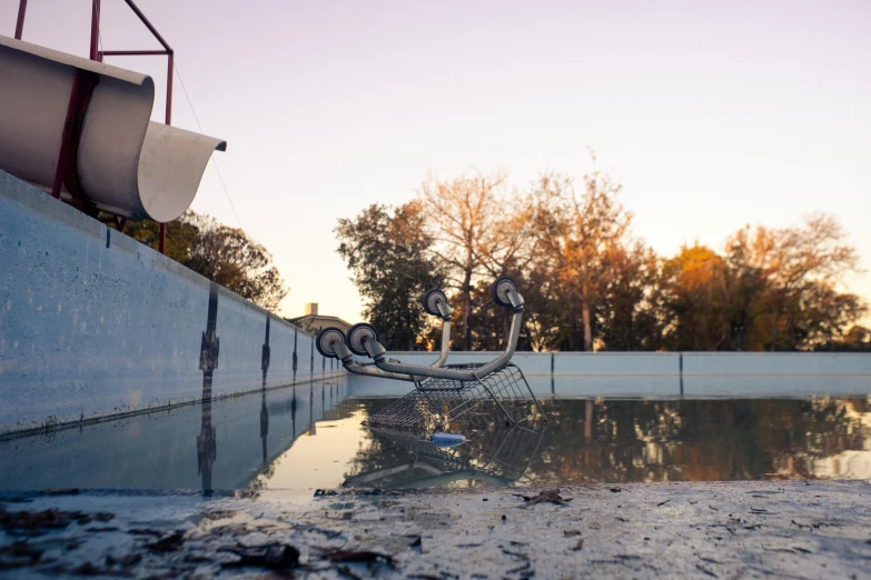 a sculpture is shown near a swimming pool