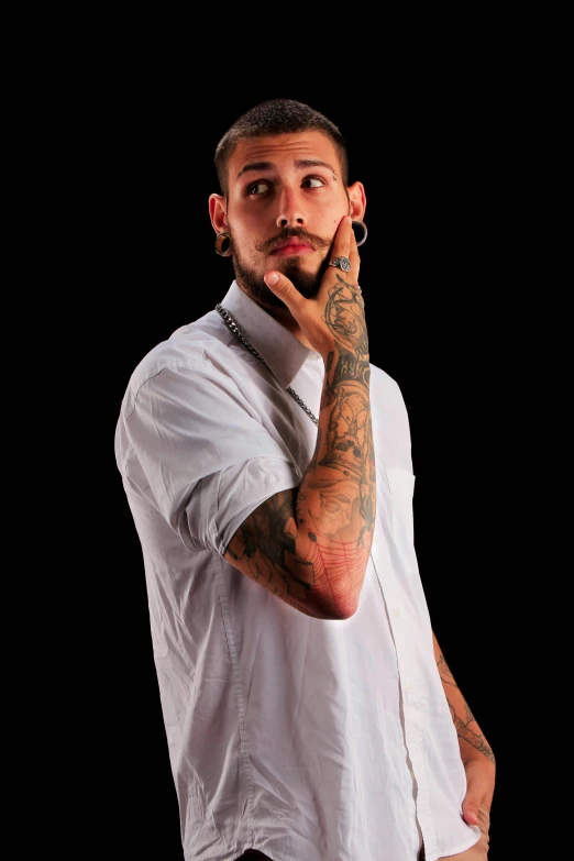 tattooed man with wristwatchs on black background