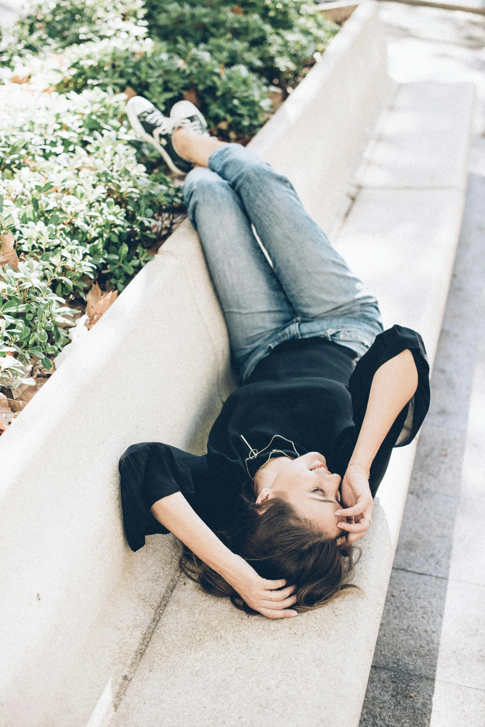 a person laying on their back on a wall