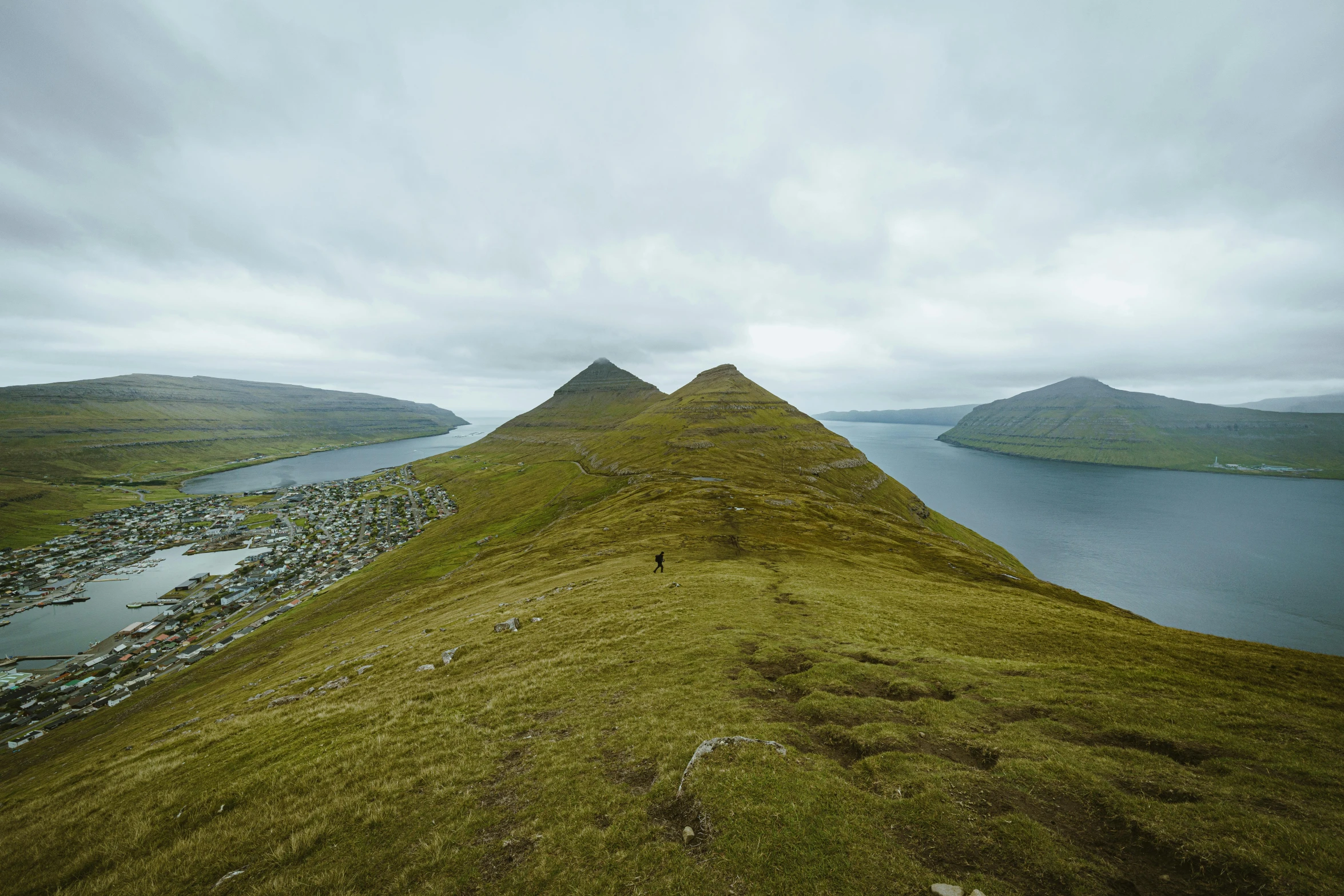 the summit of a hill with water and land around it