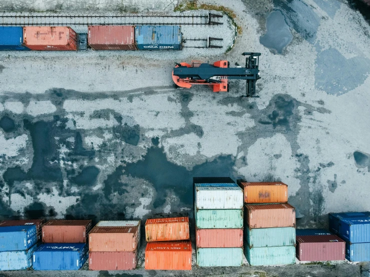 an aerial view of a dock with many containers