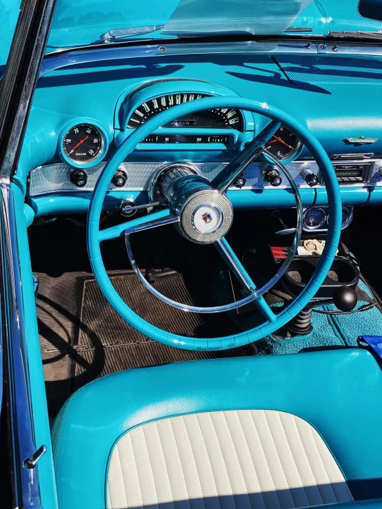 a bright blue and black dashboard of a car