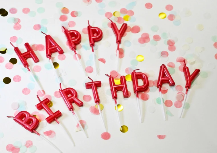 several birthday candles sit on top of small sticks