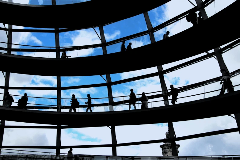 several people are in a round glass building