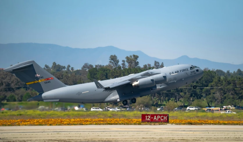 the airplane is about ready to land on the runway